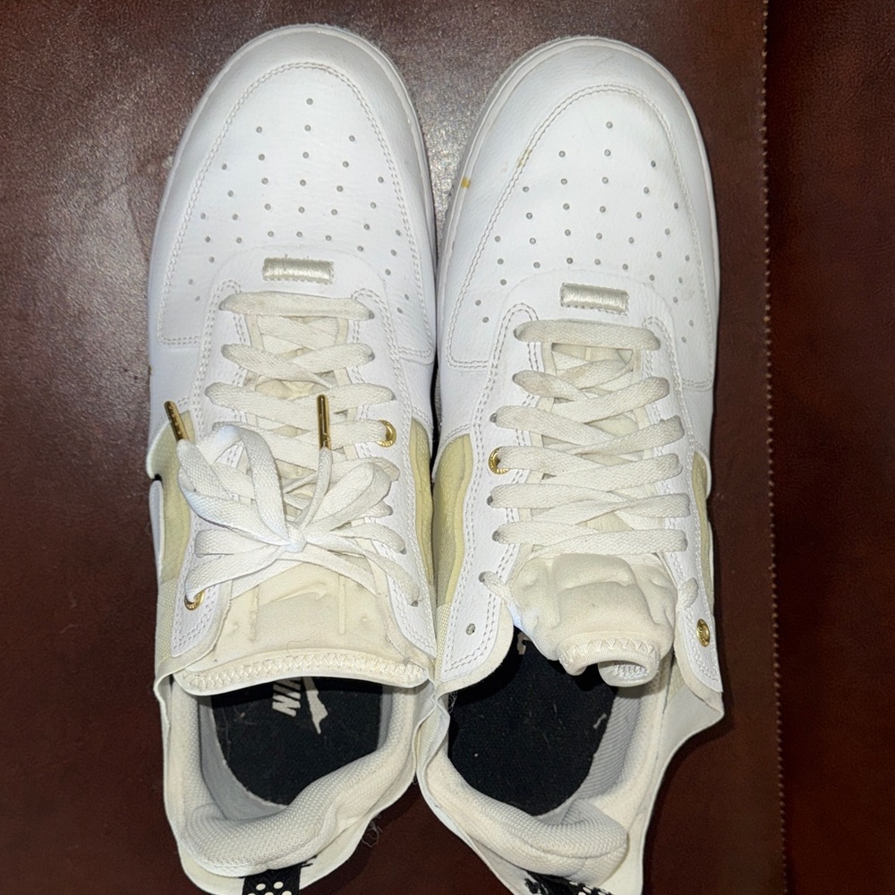 Nike White Low-Top Sneakers with Gold Accents